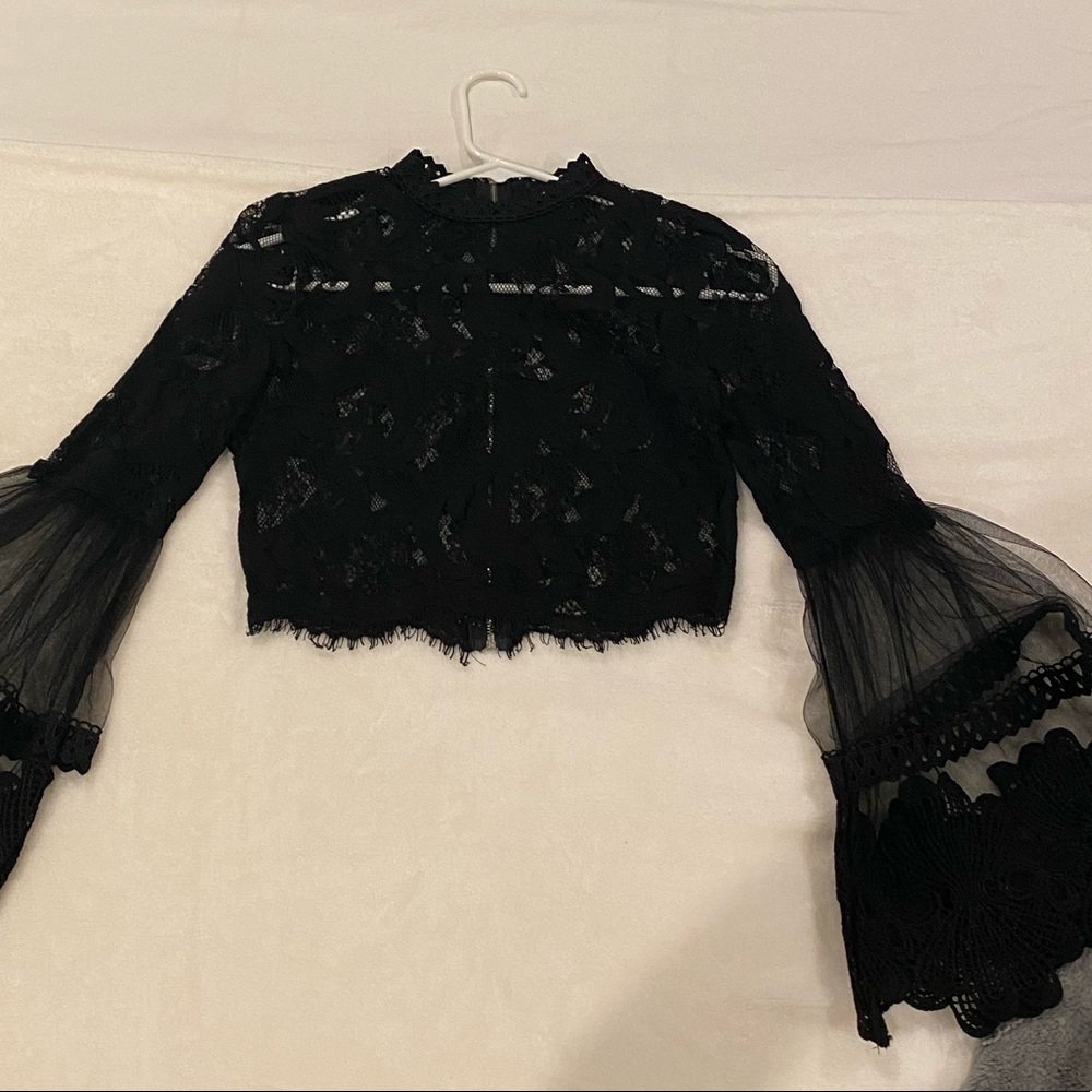 Lace Top with flared sleeves.